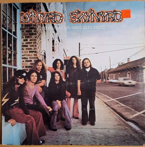 Lynyrd Skynyrd : (Pronounced 'Lĕh-'nérd 'Skin-'nérd) (LP, Album, RE, Pin)