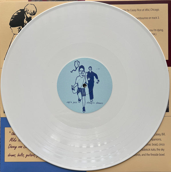 Cap'n Jazz : Burritos, Inspiration Point, Fork Balloon Sports, Cards In The Spokes, Automatic Biographies, Kites, Kung Fu, Trophies, Banana Peels We've Slipped On, And Egg Shells We've Tippy Toed Over (Shmap'n Shmazz) (LP, Album, RE, RM, Whi)